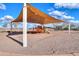 Shaded community playground with slides and climbing structures, perfect for outdoor activities at 40232 W Marion May Ln, Maricopa, AZ 85138