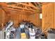 Interior shot of shed cluttered with tools, bikes, and various household items at 40232 W Marion May Ln, Maricopa, AZ 85138