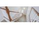 View of carpeted stairs with white and wood railing leading downstairs at 40232 W Marion May Ln, Maricopa, AZ 85138