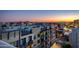 Rooftop view showcasing the community and cityscape during sunset, with mountains in the distance at 4422 N 75Th St # 8004, Scottsdale, AZ 85251
