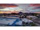 Panoramic aerial shot showcasing the cityscape and mountain range in the background at sunset at 4422 N 75Th St # 8004, Scottsdale, AZ 85251
