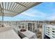 Enjoy city views from this modern balcony featuring a cozy seating area and contemporary outdoor fireplace feature at 4422 N 75Th St # 8004, Scottsdale, AZ 85251