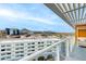 Relax on this covered balcony featuring a cozy daybed, with mountain views and city skyline backdrop at 4422 N 75Th St # 8004, Scottsdale, AZ 85251