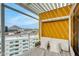 Relax on this covered balcony featuring a cozy daybed, with mountain views and city skyline backdrop at 4422 N 75Th St # 8004, Scottsdale, AZ 85251