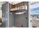 Stylish bar area with glass rack, modern design, and a window with city views at 4422 N 75Th St # 8004, Scottsdale, AZ 85251