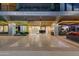 Modern building entrance with clean lines, featuring well-lit signage, lush landscaping, and inviting entryway at 4422 N 75Th St # 8004, Scottsdale, AZ 85251