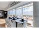 Elegant dining space with floor-to-ceiling windows offering panoramic city vistas at 4422 N 75Th St # 8004, Scottsdale, AZ 85251