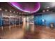 Spacious gym with modern exercise equipment and unique colored ceiling lighting at 4422 N 75Th St # 8004, Scottsdale, AZ 85251