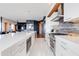 Modern kitchen with a large island, stainless steel appliances, and contemporary finishes at 4422 N 75Th St # 8004, Scottsdale, AZ 85251
