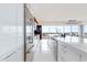 Bright kitchen featuring stainless steel refrigerator, counter seating, and spacious island with sink at 4422 N 75Th St # 8004, Scottsdale, AZ 85251