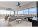 Spacious living area with a plush sofa, fireplace, and large windows with city views at 4422 N 75Th St # 8004, Scottsdale, AZ 85251