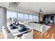 Open living space with dining area, modern fireplace, and panoramic city views at 4422 N 75Th St # 8004, Scottsdale, AZ 85251