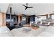 Contemporary open-concept living space featuring a fireplace and modern kitchen at 4422 N 75Th St # 8004, Scottsdale, AZ 85251