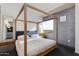 Bedroom featuring a four poster bed and views of the city at 4422 N 75Th St # 8004, Scottsdale, AZ 85251