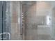 Modern shower with multiple shower heads, body jets, and tile surround, enclosed in glass at 4422 N 75Th St # 8004, Scottsdale, AZ 85251