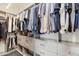 Organized walk-in closet with custom shelving, drawers, and hanging space at 4422 N 75Th St # 8004, Scottsdale, AZ 85251