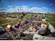 Aerial view of a carnival with rides, games, and a large crowd of people at 4516 W Fortune Dr, Phoenix, AZ 85086