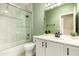 Modern bathroom offers shower-tub combo and sleek white vanity with storage at 4516 W Fortune Dr, Phoenix, AZ 85086
