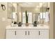 Bright bathroom offers double sinks with white cabinets and modern fixtures at 4516 W Fortune Dr, Phoenix, AZ 85086