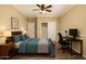 Well-lit bedroom with hardwood floors, ceiling fan, and ample storage at 4516 W Fortune Dr, Phoenix, AZ 85086
