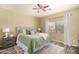 Cozy bedroom with a plush bed, soft lighting, and window at 4516 W Fortune Dr, Phoenix, AZ 85086