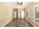 Light-filled bedroom features a ceiling fan, carpet flooring and dual closets at 4516 W Fortune Dr, Phoenix, AZ 85086