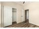 Bedroom showcasing a closet and an open doorway, plus wood-look floors at 4516 W Fortune Dr, Phoenix, AZ 85086