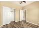 Bedroom showcasing a closet and an open doorway, plus wood-look floors at 4516 W Fortune Dr, Phoenix, AZ 85086