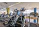 Modern fitness center with treadmills, stair climbers, and other equipment for a complete workout near the large picture window at 4516 W Fortune Dr, Phoenix, AZ 85086