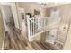 Open hallway with wood floors and white railing, leading to the upper level at 4516 W Fortune Dr, Phoenix, AZ 85086