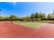 Outdoor tennis court with well-kept court surface and surrounding trees offering a peaceful and enjoyable playing environment at 4516 W Fortune Dr, Phoenix, AZ 85086