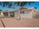 Inviting home with mature shade tree, xeriscaped yard, covered front porch, and attached garage at 4549 W Poinsettia Dr, Glendale, AZ 85304