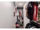 Organized walk-in closet featuring ample hanging storage and shelving for efficient organization at 4549 W Poinsettia Dr, Glendale, AZ 85304