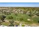 Scenic aerial shot of a neighborhood beside a lush golf course offers a serene and picturesque setting at 4822 N Barranco Dr, Litchfield Park, AZ 85340