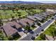 Aerial view of neighborhood homes and a golf course, showcasing a serene community at 4822 N Barranco Dr, Litchfield Park, AZ 85340