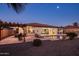 Entertainer's backyard with pool, lounge chairs, outdoor kitchen with grill and pergola, and covered patio at 4822 N Barranco Dr, Litchfield Park, AZ 85340