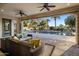 Spacious covered patio overlooking a sparkling pool and landscaped backyard oasis at 4822 N Barranco Dr, Litchfield Park, AZ 85340