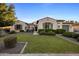 Charming single-story home featuring well-maintained landscaping and a manicured lawn at 4822 N Barranco Dr, Litchfield Park, AZ 85340