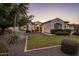 Beautiful home with well-manicured landscaping and gated courtyard entrance at 4822 N Barranco Dr, Litchfield Park, AZ 85340