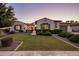 Charming single-story home featuring well-maintained landscaping and a manicured lawn at 4822 N Barranco Dr, Litchfield Park, AZ 85340