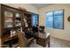 Well-appointed office with custom cabinetry, a spacious desk, and ample storage for a productive workspace at 4822 N Barranco Dr, Litchfield Park, AZ 85340