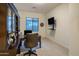 Dedicated office space with built-in shelving, a large desk, and a comfortable executive chair at 4822 N Barranco Dr, Litchfield Park, AZ 85340
