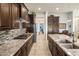 Modern kitchen features granite countertops, stainless steel appliances, and ample cabinet space at 4822 N Barranco Dr, Litchfield Park, AZ 85340