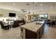 Open-concept living room boasts an eat-in kitchen, a cozy fireplace, and seamless access to the backyard at 4822 N Barranco Dr, Litchfield Park, AZ 85340