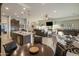 Open-concept living space boasts dark wood cabinetry, a cozy fireplace, and seamless flow at 4822 N Barranco Dr, Litchfield Park, AZ 85340