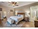 Relaxing main bedroom featuring a king bed, soft lighting, and a calming color palette for restful nights at 4822 N Barranco Dr, Litchfield Park, AZ 85340