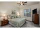 Elegant main bedroom with soft carpet, stylish furniture, and abundant natural light, creating a relaxing retreat at 4822 N Barranco Dr, Litchfield Park, AZ 85340