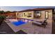 Inviting backyard pool and patio with lounge chairs for relaxing by the water at 4822 N Barranco Dr, Litchfield Park, AZ 85340