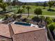 Backyard pool and lounge area, with serene golf course views at 4822 N Barranco Dr, Litchfield Park, AZ 85340