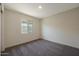 Inviting bedroom featuring plush carpeting, soft lighting, and a serene atmosphere at 551 S West Virginia Ave, Florence, AZ 85132
